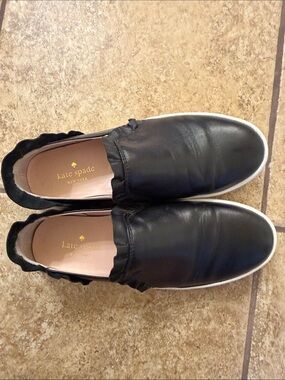 kate spade black leather slip-on sneakers with white soles
